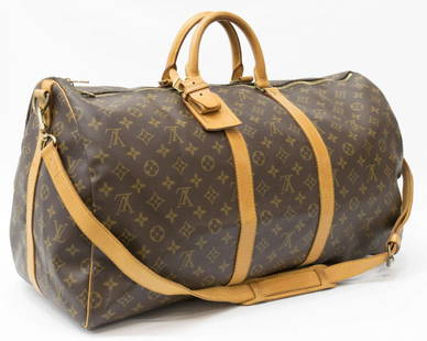 LOUIS VUITTON 'KEEPALL 55' BANDOULIERE DUFFLE BAG: Louis Vuitton monogram canvas 'Keepall 55" Bandouliere traveling duffle bag, adjustable and detachable strap, leather handles and trim, retaining luggage tag, gold tone hardware with dual zippers, ope