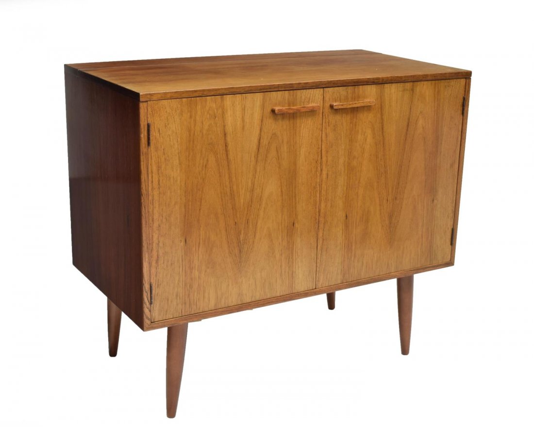 DANISH MID-CENTURY MODERN ROSEWOOD SERVER: Danish mid-century modern rosewood server, c. 1960, the rectangular top partially hinged opening to an upper shelf, two front doors open to the upper shelf and a lower divided shelf, rising on turned 