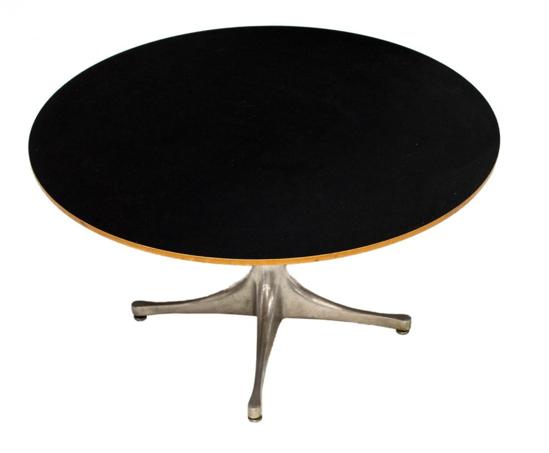 GEORGE NELSON PEDESTAL TABLE BY HERMAN MILLER: Maple veneer and aluminum pedestal table, design by George Nelson, manufactured by Herman Miller, label underside, 16"h, 28.5"diam Start Price: $150.00