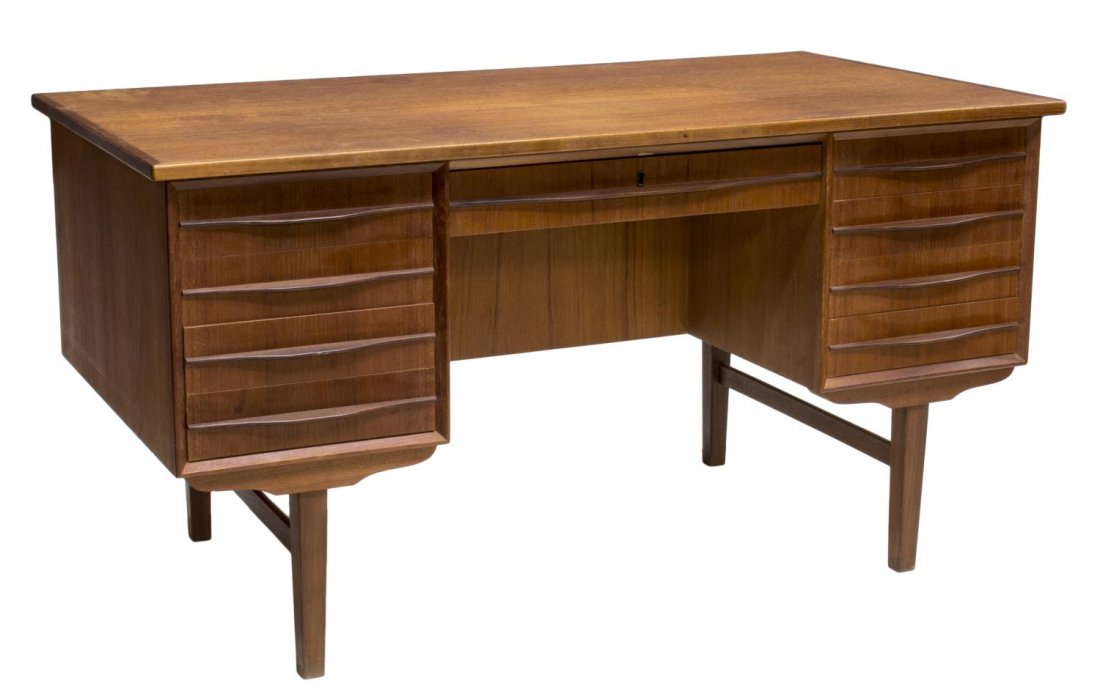 DANISH MID-CENTURY MODERN EXECUTIVE WRITING DESK: Danish mid-century modern teakwood executive writing desk, c. 1950's, the rectangular top over two sets of four drawers, single drawer with lock to center, front of desk fitted with storage, rising on