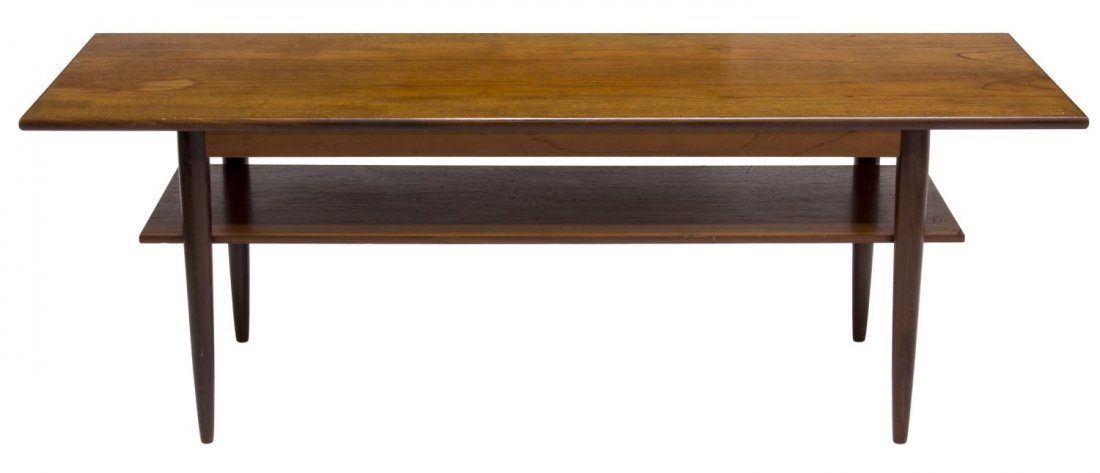 DANISH MID-CENTURY MODERN TEAK COFFEE TABLE: Danish mid-century modern teakwood coffee table, 1950's, the rectangular top rising on tapered turned supports joined by a lower shelf, 20.5'h, 59"w, 17"d Start Price: $100.00