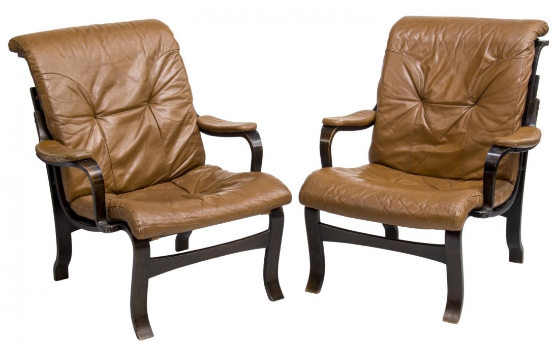 (2) DANISH MID-CENTURY BENTWOOD LEATHER CHAIRS: (lot of 2) Danish mid-century modern bentwood lounge chairs, 1960's, each with removable brown leather cushions flanked by padded arms, 34"h, 29"w, 34"d Start Price: $150.00
