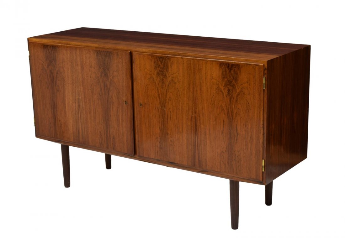 DANISH MID-CENTURY MODERN ROSEWOOD SIDEBOARD: Danish mid-century modern rosewood finish sideboard, 1960's, a rectangular top above two drawers opening to shelves and drawers, rising on tapered turned supports, variation to top color, 31.5"h, 54.5
