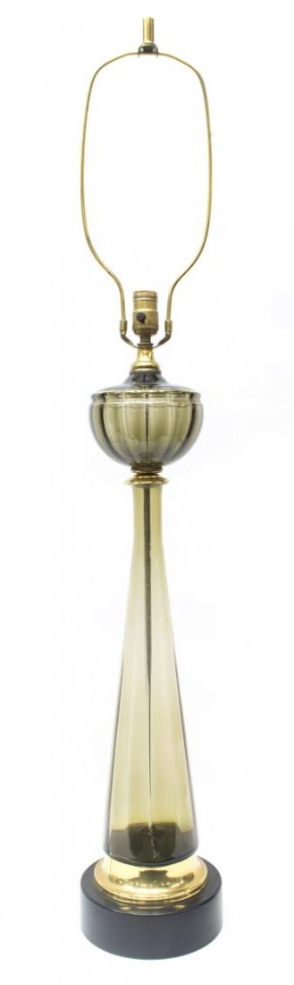 MURANO COLORED ART GLASS TABLE LAMP, ITALY 20THC: Murano art glass table lamp, Italy mid-20th c., having a single light over a font, above the tapered central standard, rising on a brass foot and circular wooden base, 32.5"h, 8lbs Start Price: $50.00