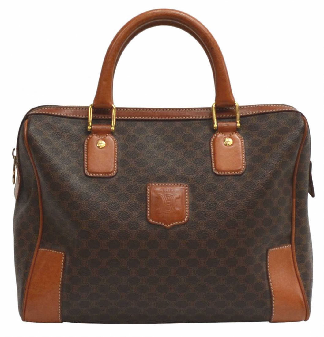 CELINE BROWN MACADAM MONOGRAM CANVAS HANDBAG: Celine Paris handbag in brown macadam monogrammed canvas, brown leather handles, trim and accents, gold tone hardware, top zipper opening to brown lined interior with single zip pocket, bag: approx 9"