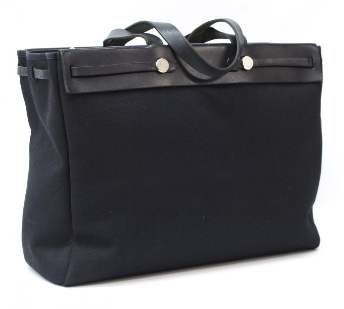 HERMES 'HERBAG CABAS' INTERCHANGEABLE TOTE BAG: HermÃ¨s "Herbag Cabas" large changeable tote bag in black canvas, having leather handles and trim, palladium hardware, interchangeable extended exterior canvas, both interiors having single hanging