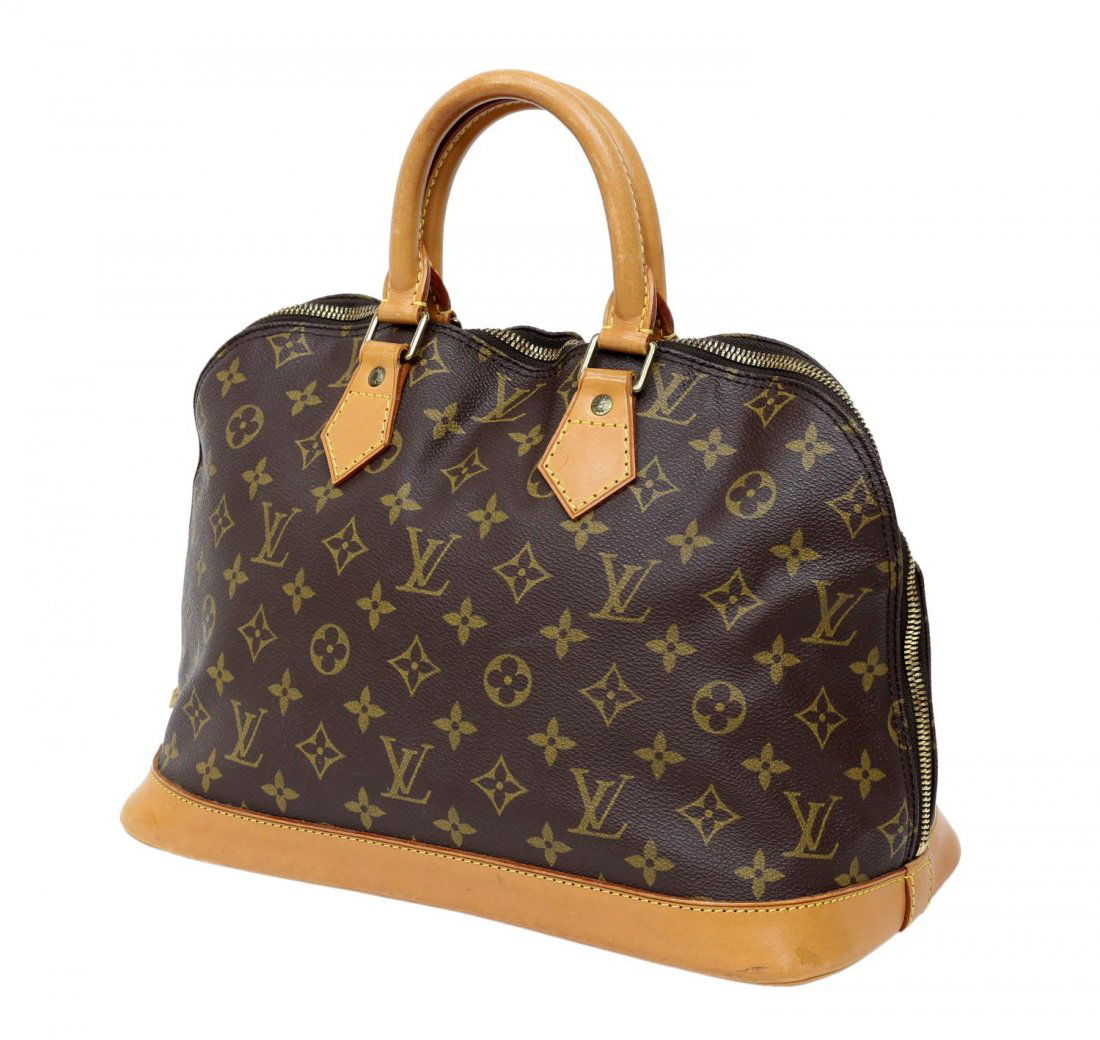 LOUIS VUITTON 'ALMA' MONOGRAM CANVAS HANDBAG: Louis Vuitton "Alma" handbag in monogram canvas, having leather handles and trim, gold tone hardware, zip top opening to brown canvas lined interior with slot pocket, minor patination and spotting to