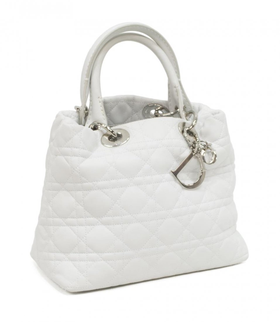 CHRISTIAN DIOR 'LADY' QUILTD WHITE LEATHER HANDBAG: Christian Dior "Lady Dior" cannage quilted white leather handbag, having silver tone hardware, the double handles over the open top, interior lined in monogram fabric, cell phone and zipper pocket, ke