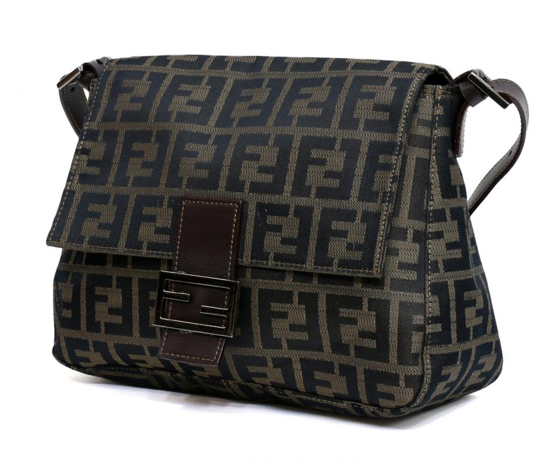 FENDI ZUCCA MONOGRAMED CANVAS & LEATHER HANDBAG: Fendi shoulder bag in brown Zucca monogramed canvas, brown leather accents and adjustable shoulder strap, dark silver tone hardware, magnetic snap opening flap to green cloth lined interior with singl