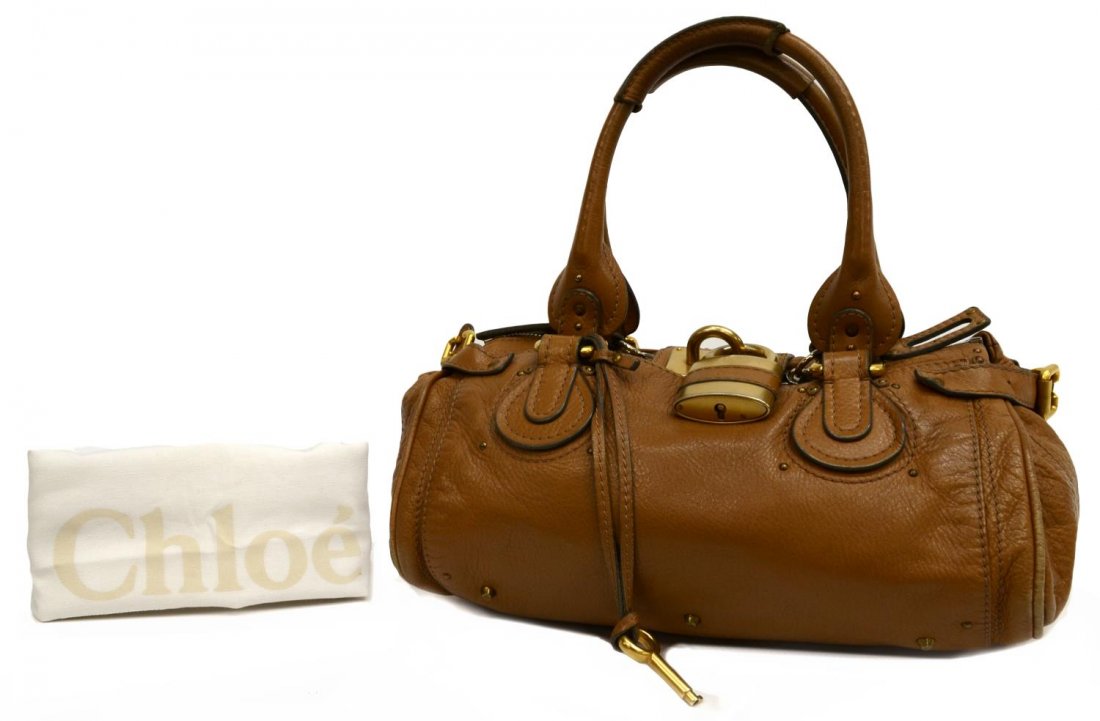 CHLOE PADDINGTON MM TAUPE LEATHER SHOULDER BAG: Chloe "Paddington" in taupe leather with gold tone hardware, two exterior slot pockets, top unzips to dark brown cloth lined interior featuring slot and zipped pockets, on small metal feet, with signa