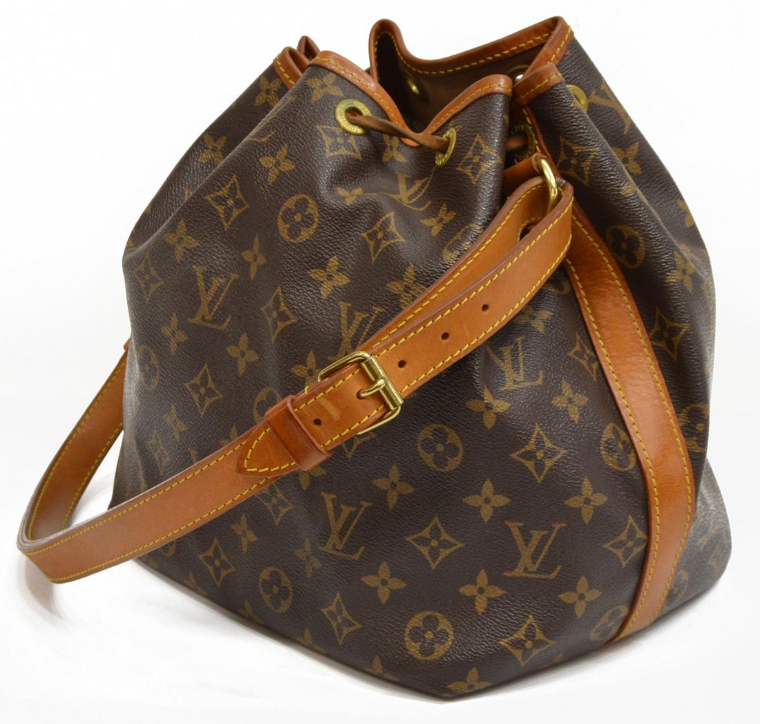 LOUIS VUITTON 'NOE PM' MONOGRAM CANVAS BUCKET BAG: Louis Vuitton "Noe PM" drawstring bucket bag in monogram canvas, adjustable leather strap and trim, gold tone hardware, drawstring top opening to a brown canvas interior and key tab, patination, creas