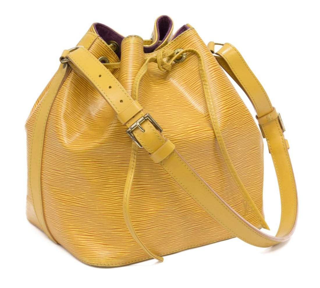 LOUIS VUITTON YELLOW EPI LEATHER 'NOE' BUCKET BAG: Louis Vuitton "Noe PM" drawstring bucket bag in Tassil yellow Epi leather, having an adjustable strap, gold tone hardware, the drawstring top opens to purple interior with key tab, minor scuffing to b