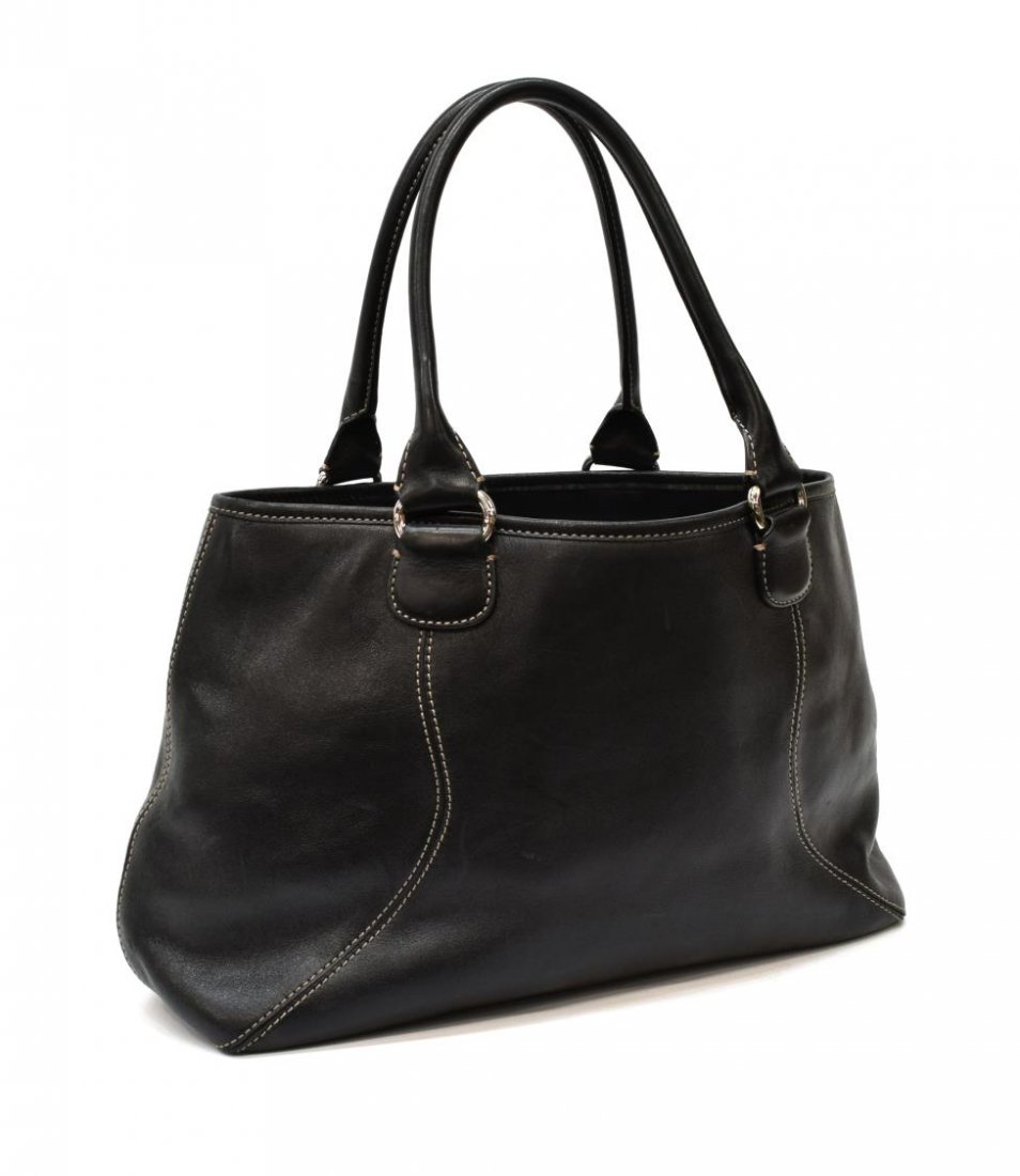 COLE HAAN BLACK LEATHER DOUBLE HANDLED TOTE: Cole Haan black leather double handled tote bag, having silver hardware, white stitching to exterior, with snap top opening to blue fabric lined interior, having central zipper compartment, slot pocke