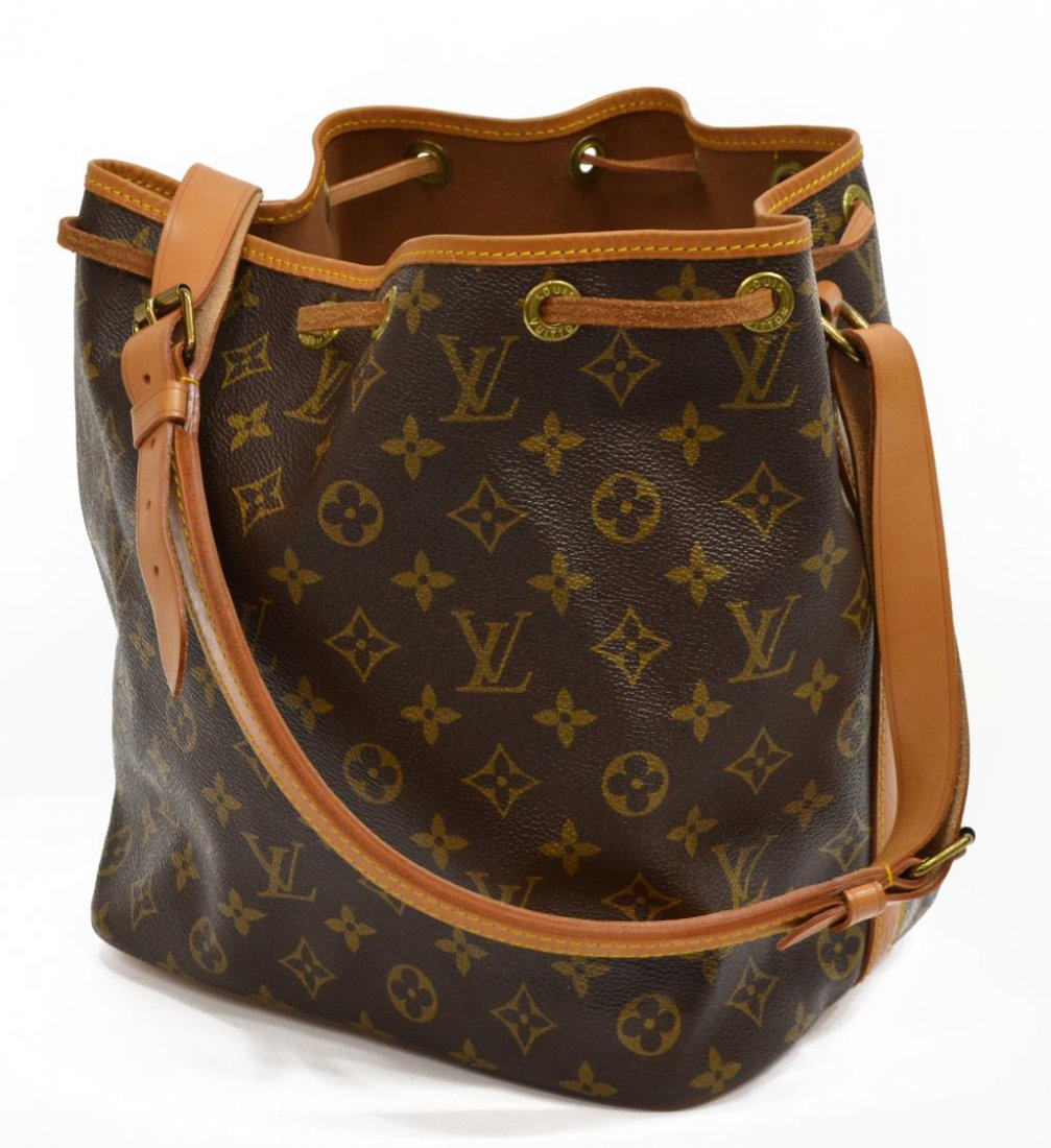 LOUIS VUITTON 'NOE PM' MONOGRAM CANVAS BUCKET BAG: Louis Vuitton "Noe PM" drawstring bucket bag in monogram canvas, leather adjustable should strap and trim, gold tone hardware, brown fabric lined interior, patination, spotting and minor creasing to l
