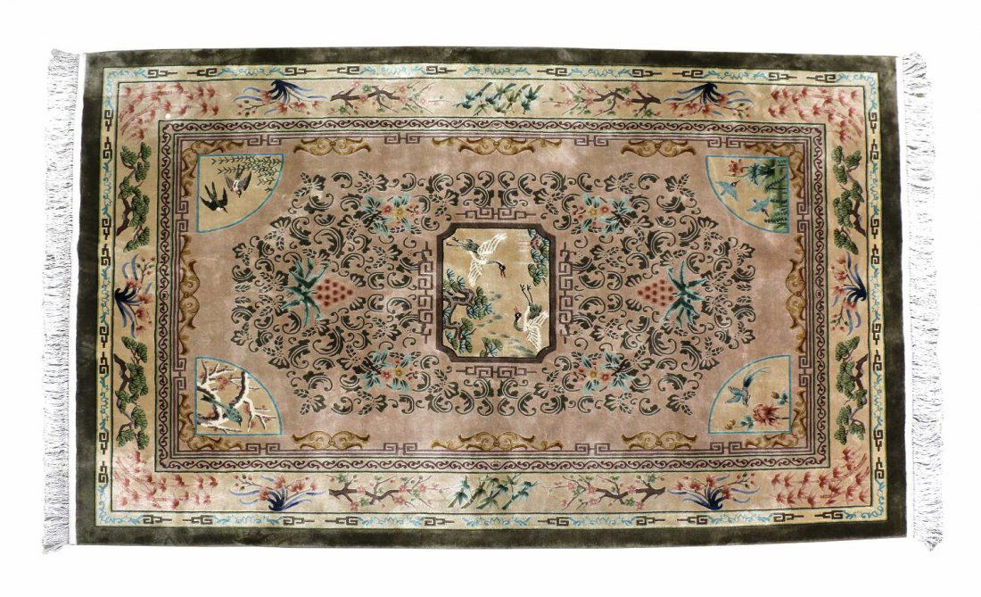 EXCEPTIONAL CHINESE ALL SILK RUG, 6' x 9': Chinese silk 120 line rug, c. 1980, green, beige, apricot color, decorated with florals, foliate, small birds and cranes, 6'9" exclusive of fringe Start Price: $300.00