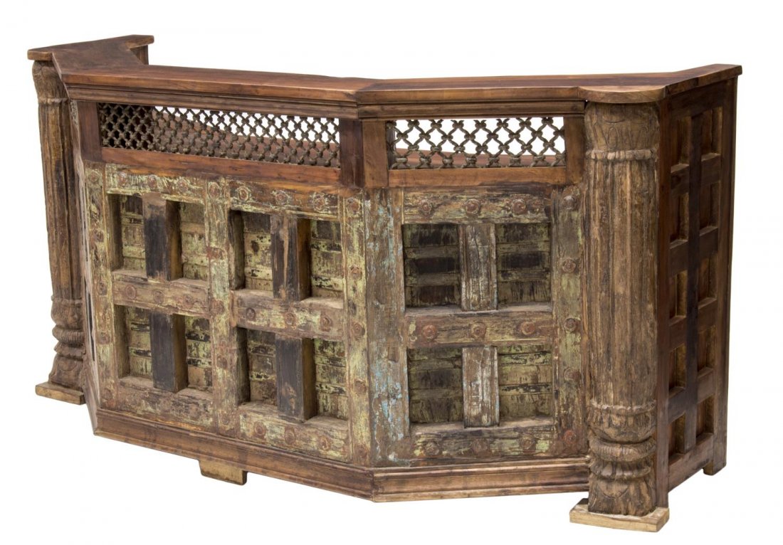 TEAKWOOD CLUB BAR, INDIA: Teakwood club bar, Burma, having an upper shelf over pierced iron lattice panels, above work surface, fitted with two drawers and stemware holders, and bottle racks, 41"h, 86"w, 21"d Start Price: $500