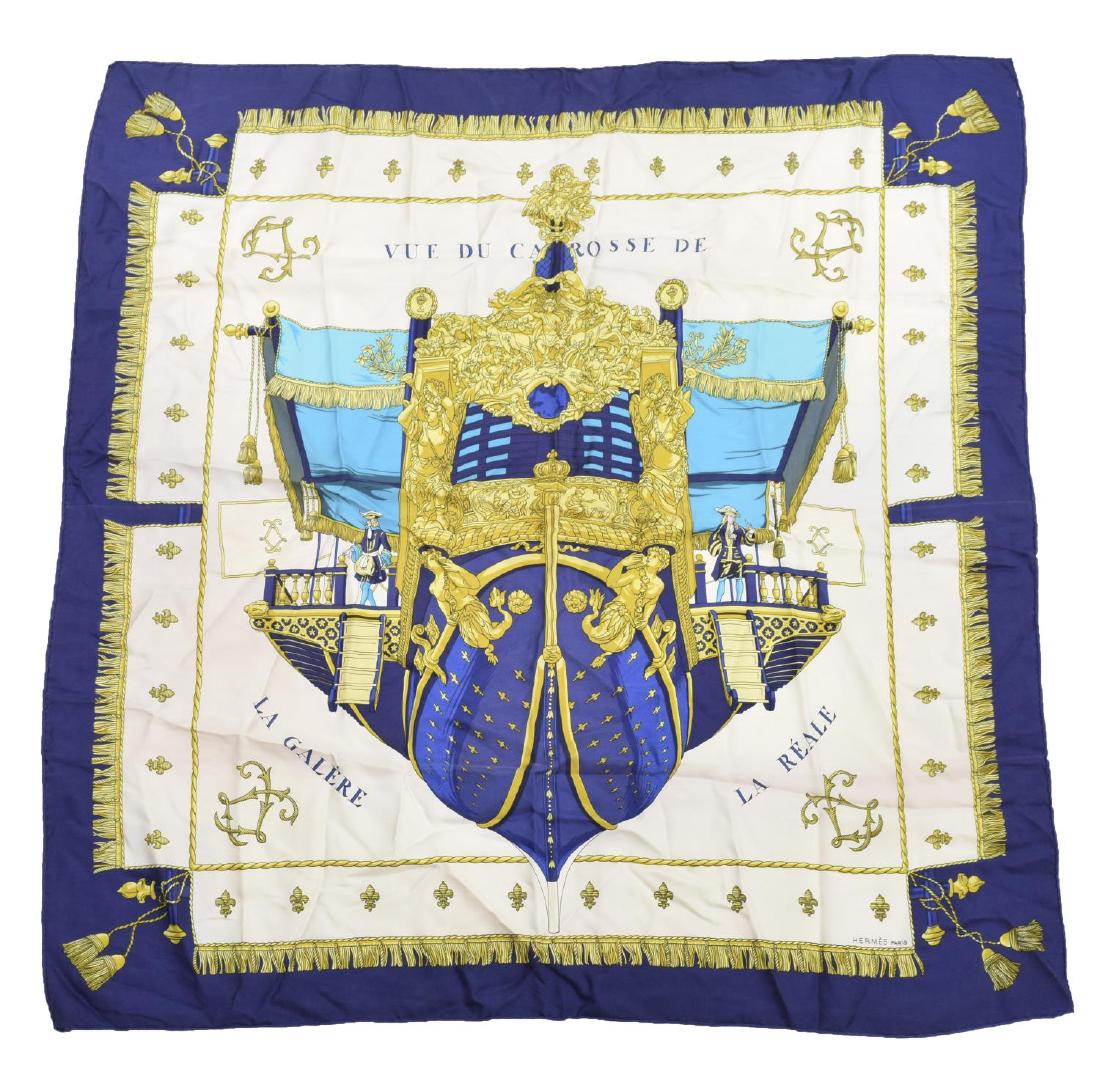 HERMES VUE DU CAROSSE DE LA GALERE LA REALE SCARF: Hermes silk twill scarf, 'Vue Du Carosse De La Galere La Reale', designed by Hugo Grygkar (Germany, 1907-1959), in blues, golds, and cream, small stain in upper corner, lacking material tag, 34" sq, 0
