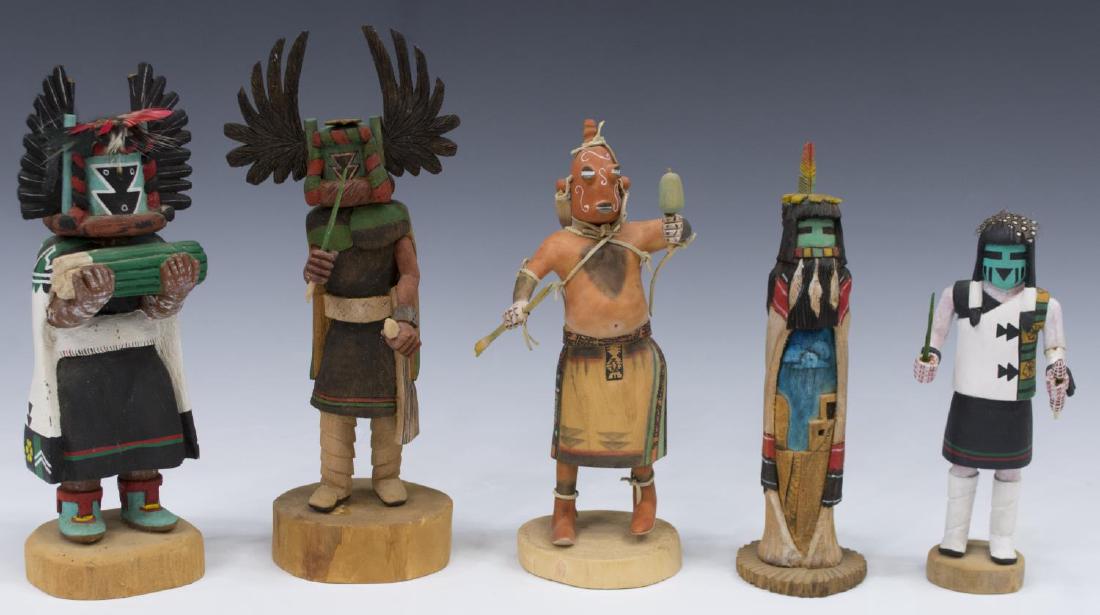 (5) NATIVE AMERICAN CARVED WOODEN KACHINA DOLLS: (lot of 5) Native American carved Kachina dolls, comprising: (1) "Corn Head Dancer", signed George & Mae Hunch, 9.5"h; (1) figure with bundle of sticks, signed S. Nicholas, Bacavi Village, 9.5"h; (1) 