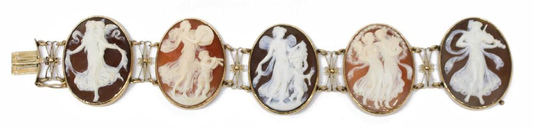 LADIES ESTATE 14K GOLD CARVED SHELL CAMEO BRACELET: Ladies estate 14kt yellow gold and carved shell cameo link bracelet, having (5) oval carvings depicting beauties and putti in dance and playing instruments, bezel set in plain frames, joined by scroll