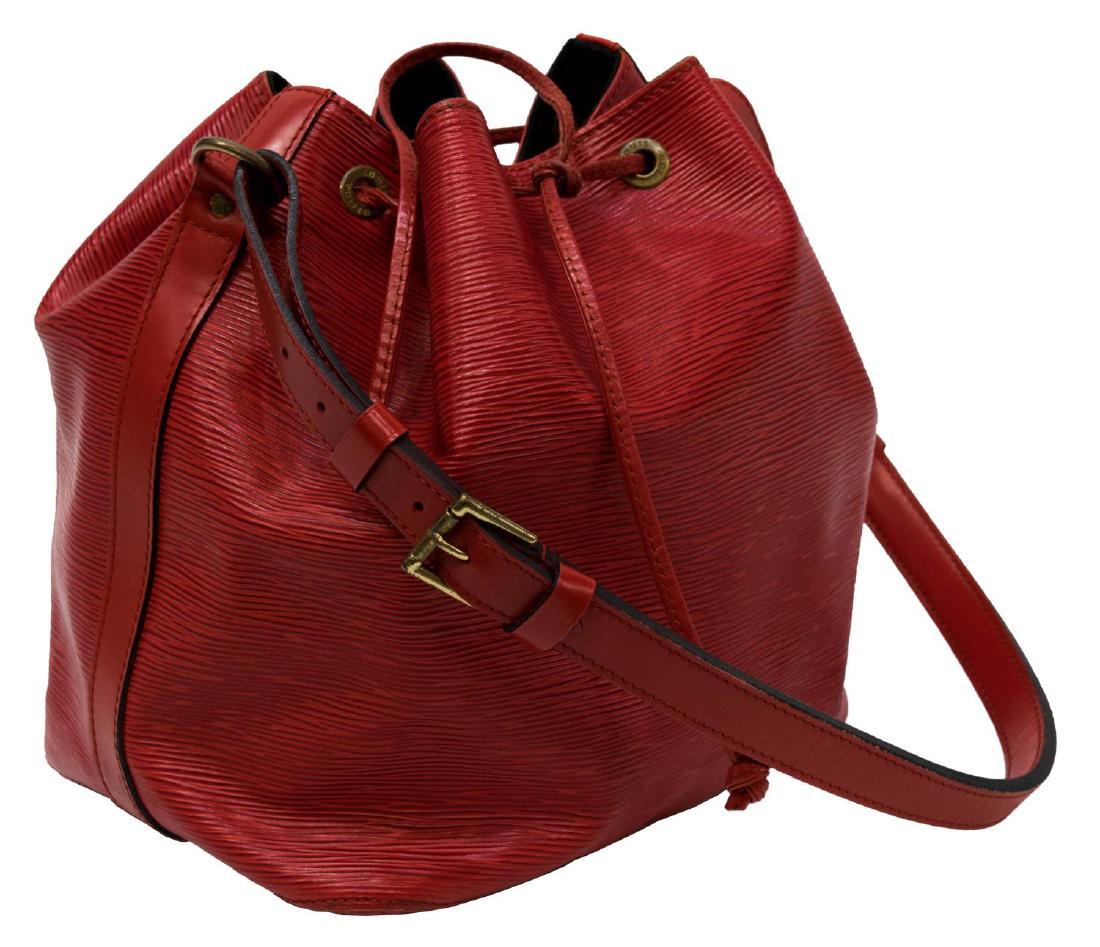 LOUIS VUITTON 'NOE PM' RED EPI LEATHER BUCKET BAG: Louis Vuitton "Noe PM" drawstring bucket bag in red Epi leather, having an adjustable leather strap and trim, gold tone hardware, the drawstring top opening to a black fabric interior with a zipper po