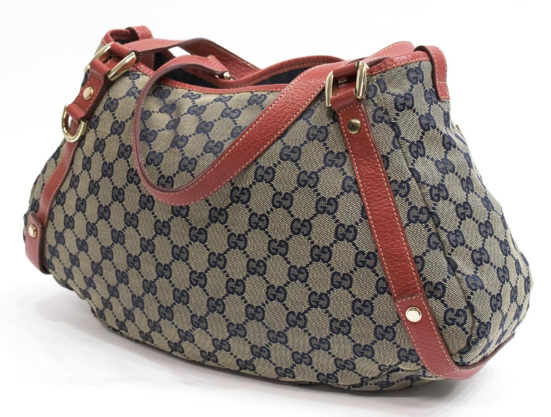 GUCCI 'PELHAM HOBO' MONOGRAM CANVAS SHOULDER BAG: Gucci "Pelham Hobo" shoulder bag, in monogrammed canvas, two red leather top handle straps and red leather accents, light gold tone hardware, zippered and cell phone pocket to interior, one snap to re
