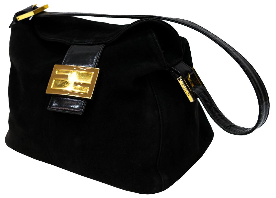 FENDI BLACK SUEDE AND LEATHER SHOULDER BAG: Fendi shoulder bag in black suede and leather, having silver tone hardware, black fabric interior with one side zipper pocket, fold over flap closure, strap having buckle to each end, accompanied by d