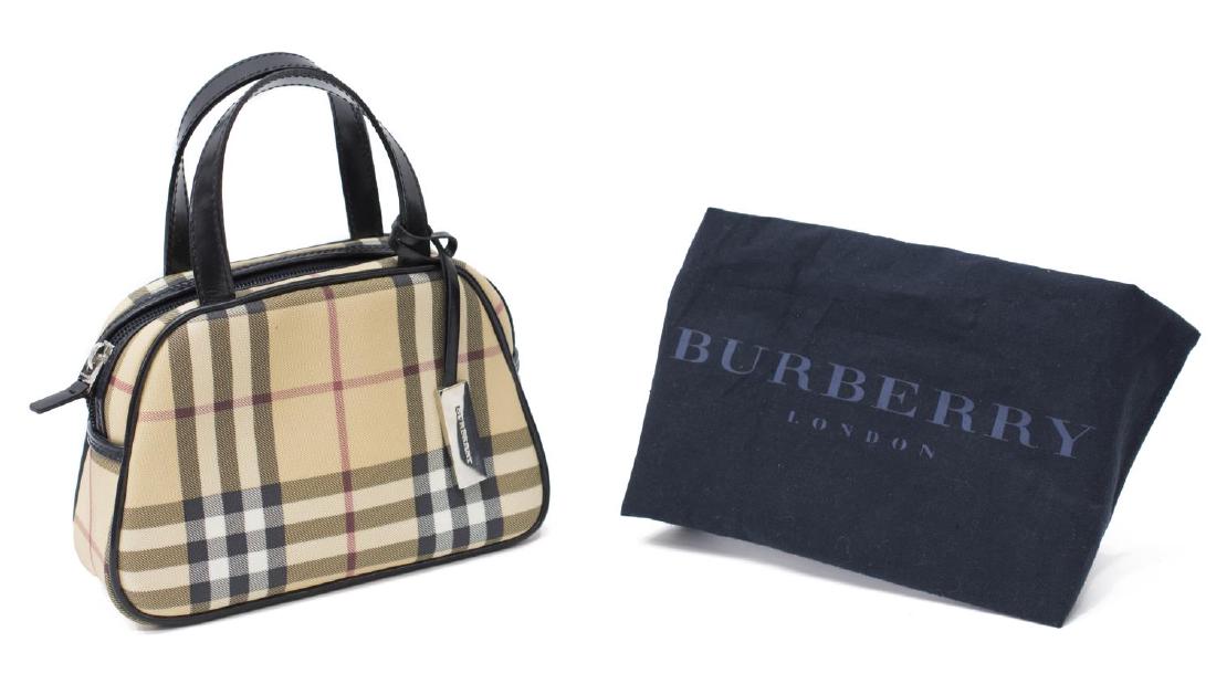 BURBERRY MINI NOVA CHECK CANVAS HANDBAG: Burberry mini handbag in "Nova Check" canvas, two leather top handles, leather piping and accents, silver tone hardware, opening to black monogram fabric liner, leather pocket to interior, retaining r