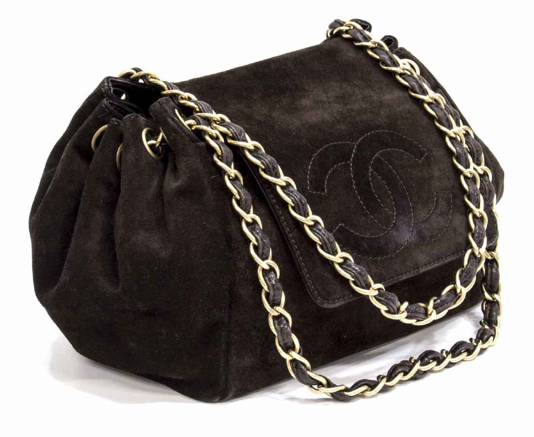 CHANEL BROWN SUEDE & LEATHER CHAIN SHOULDER BAG: Chanel shoulder bag in brown suede and leather, having gold tone hardware, leather woven shoulder strap, the front flap with stitched interlocking CC logo, opening to front slot pocket, monogram lined