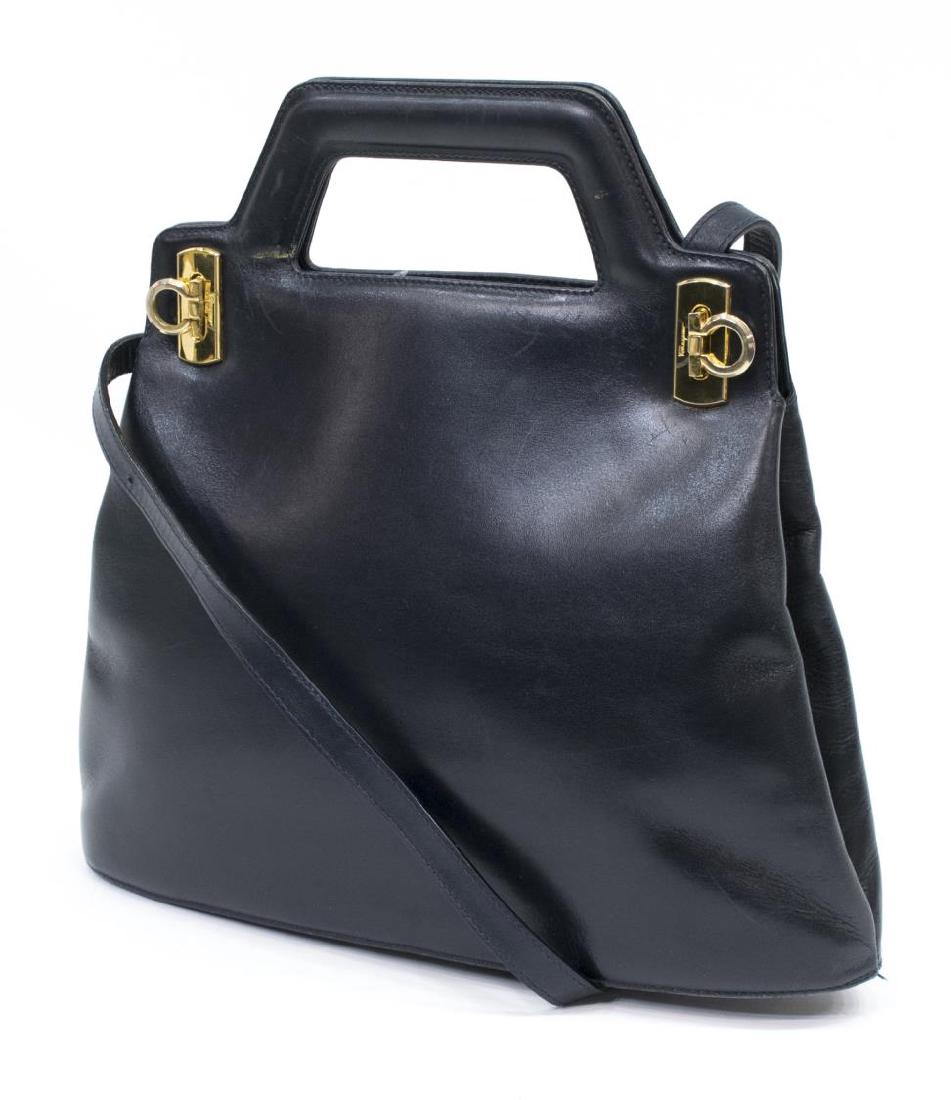 FERRAGAMO NAVY LEATHER HANDBAG WITH SHOULDER STRAP: Ferragamo handbag with adjustable detachable shoulder strap, in navy smooth leather, two folding clasp closures to top, gold tone hardware, some creasing, wear and surface dirt to leather, bag: approx