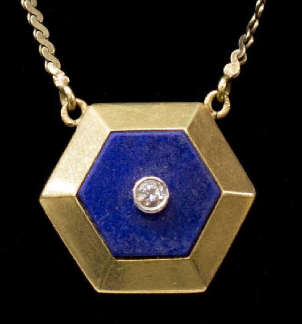 LADIES ESTATE 18K DIAMOND & LAPIS PENDANT NECKLACE: Ladies estate 18kt yellow gold lapis pendant necklace, the hexagonal shaped lapis stone centered by (1) round cut diamond, approx. 0.05ct, issuing from a s-link chain, marked, 16"l, 6.9 grams *Provena