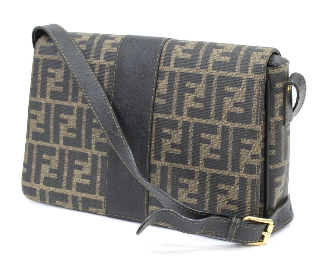 FENDI MONOGRAM CANVAS CROSS BODY SHOULDER BAG: Fendi crossbody shoulder bag, in monogrammed coated canvas, brown leather shoulder strap and central strip, zippered pocket to interior, some wear marks to leather, bag: approx 6.75"h, 11"w, 2.75"d, 1