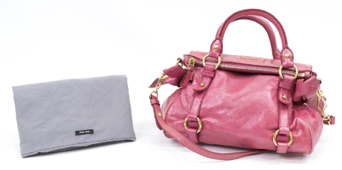 MIU MIU PINK 'BOW' HANDBAG WITH SHOULDER STRAP: Miu Miu "Vitello Lux Bow Bag" handbag, in pink leather, bow accents to each side, with detachable shoulder strap, gold tone hardware and feet, open pocket to interior, accompanied by dust bag, surface