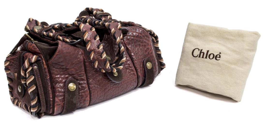 CHLOE 'SILVERADO' LEATHER & SUEDE SHOULDER BAG: Chloe "Silverado" burgundy leather and suede shoulder bag, having silver tone hardware, woven trim, with two side pockets with flap closures, double handles over zipper top, and two slot pockets, open