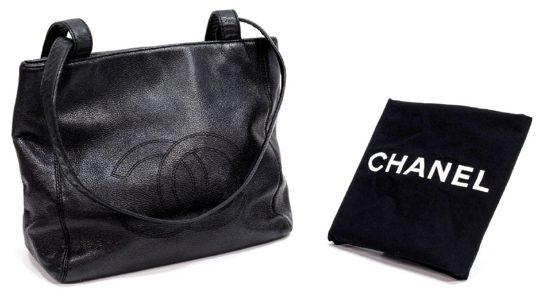 CHANEL BLACK LEATHER DOUBLE HANDLED TOTE BAG W/BOX: Chanel tote bag in black leather, having two shoulder straps, silver tone hardware, the front with stitched interlocking CC logo, with snap closure, opening to interior with two zipper pockets, accomp