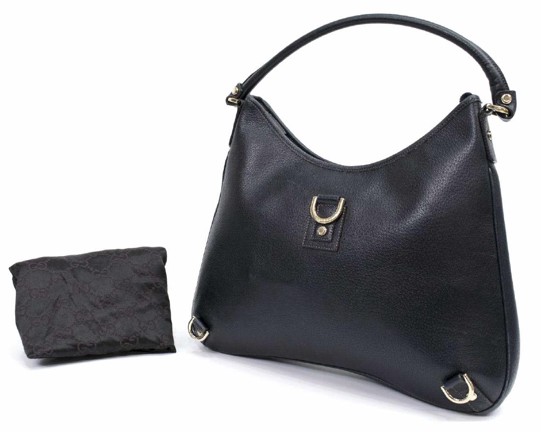 GUCCI 'ABBEY HOBO' D-RING NAVY LEATHER HANDBAG: Gucci "Abbey Hobo" handbag in navy grained leather, three D-rings to front, single top handle, gold tone hardware, zippered and cell phone pocket, accompanied by dust bag, some scuffs, bag: approx 12.