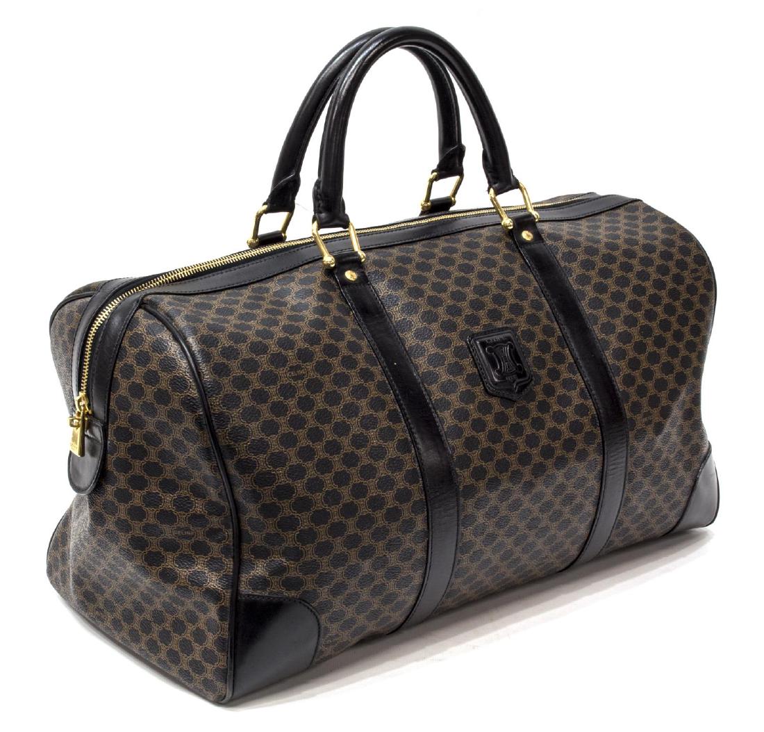CELINE MONOGRAM CANVAS BOSTON TRAVEL BAG: Celine "Boston" duffle bag in Macadam monogram canvas, emblem to front center, two top carrying handles, leather accents and piping, gold tone hardware, hanging zippered pocket to interior, some light
