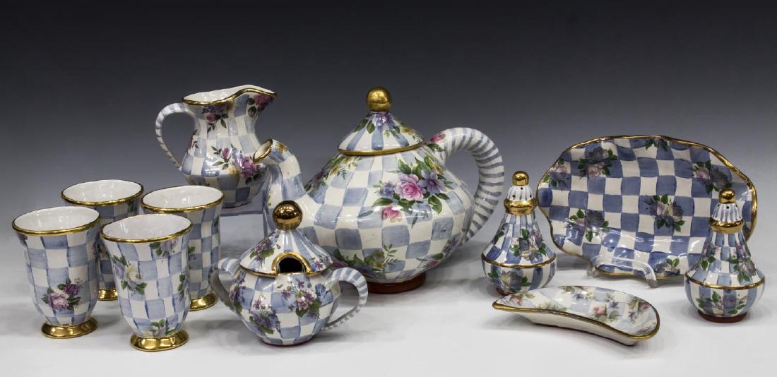 (11) MACKENZIE-CHILDS HONEYMOON MORNING GLORY GRP: (lot of 11) MacKenzie-Childs hand painted ceramic terra cotta tableware, in "Honeymoon" pattern, in "Morning Glory" color, comprising: (1) teapot, 9"h, 11"w; (1) creamer, 5"h; (1) covered sugar bowl, 