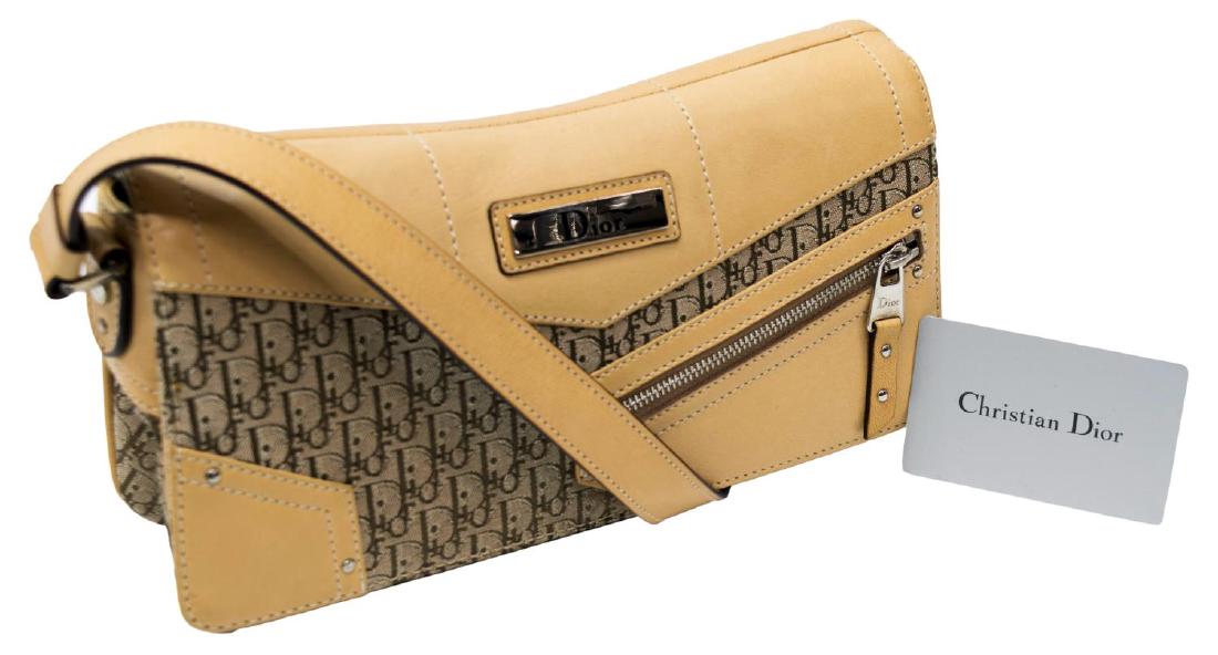DIOR MONOGRAM CANVAS SHOULDER BAG, ZIPPER ACCENT: Dior "Pochette" handbag in "Diorissimo" monogram canvas, zippered leather pocket accent to front, leather and fabric adjustable shoulder strap, leather accents and piping, silver tone hardware, flap t