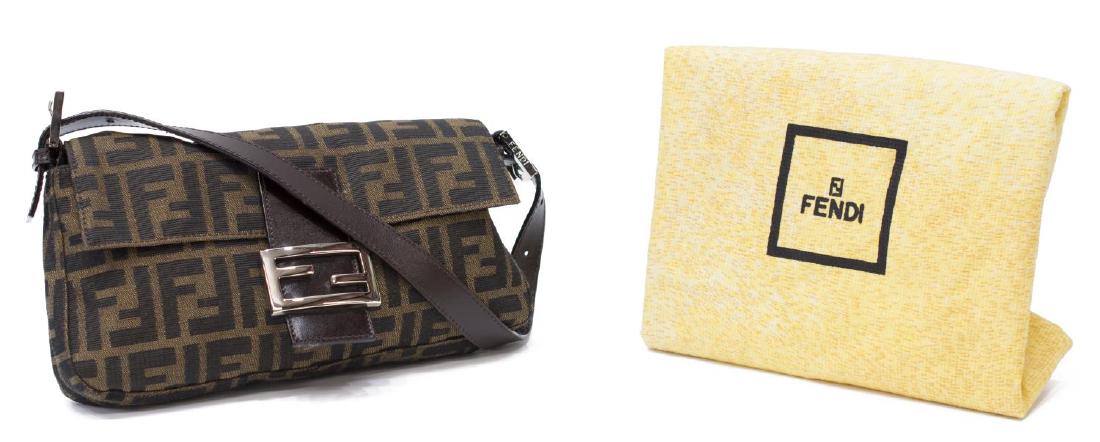FENDI ZUCCA MONOGRAM CANVAS BAGUETTE SHOULDER BAG: Fendi "Baguette" handbag in brown "Zucca" pattern, adjustable brown leather strap, silver tone hardware, magnetic logo clasp, top opens to brown cloth lined interior featuring single zip pocket, accom