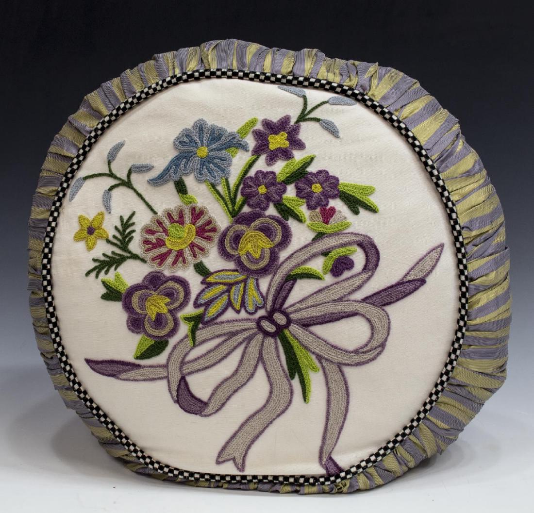 LARGE MACKENZIE-CHILDS FLORAL CREWL & DOWN PILLOW: Large round Mackenzie-Childs pillow having crewel floral motif with bow, Courtly check piping, some small runs and picks to ruched side panels, down insert, approx 20"diam, 3.75lbs *Provenance: Barnar