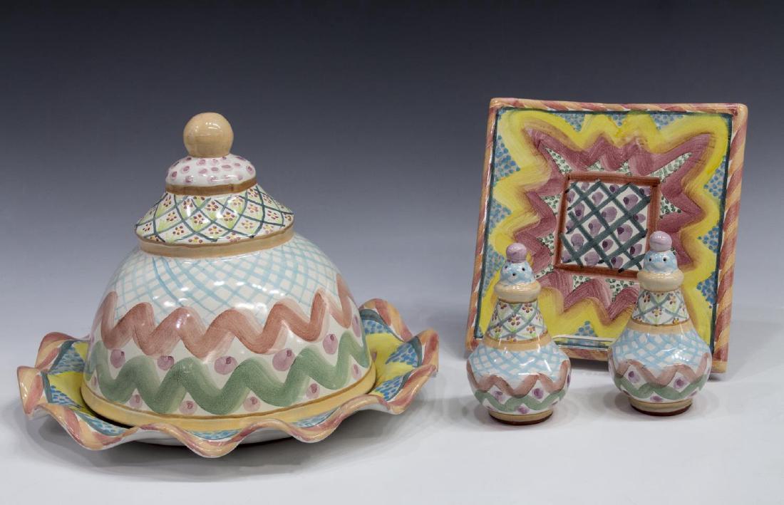 (4) MACKENZIE-CHILDS CERAMIC TABLEWARE COLLECTION: (lot of 4) MacKenzie-Childs ceramic tableware, in "Keukenhof" and "Heather", (1) dome, approx 8"h, 8.5"diam; (2) salt and pepper shakers, approx 5"h; (1) square trivet; (1) wavy rim plate, approx 12.2