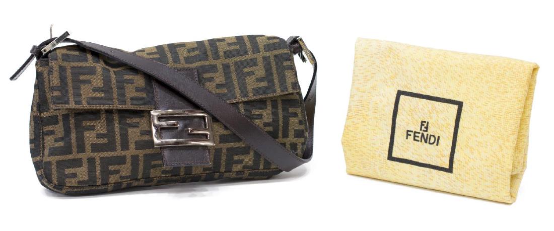 FENDI ZUCCA MONOGRAM CANVAS BAGUETTE SHOULDER BAG: Fendi "Baguette" handbag in brown "Zucca" pattern, adjustable brown leather strap, silver tone hardware, magnetic logo clasp, top opens to brown cloth lined interior featuring single zip pocket, accom