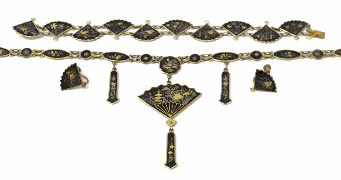 (4) VINTAGE GOLD PLATED JAPANESE DAMASCENE SUITE: (lot of 4) Vintage gold plated fan shaped Japanese Damascene jewelry suite, comprising: (2) screw back earrings, (1) bracelet, (1) necklace, largest: 24"l, (BRC025) (EC015) (N003) Start Price: $80.00
