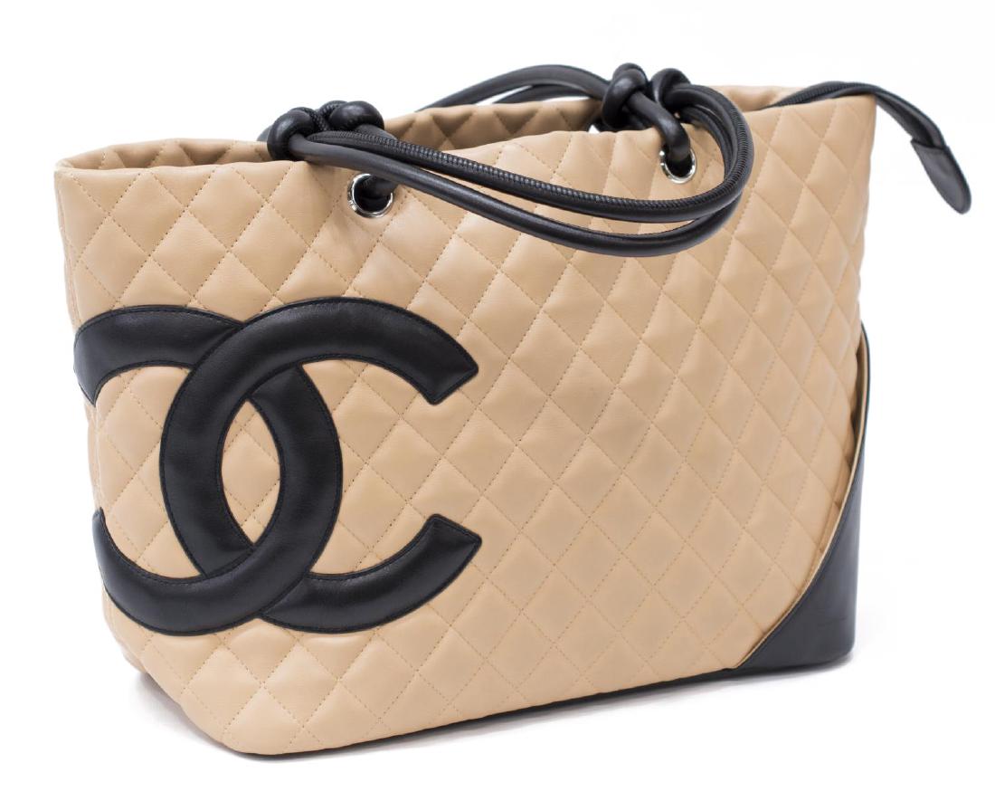 CHANEL 'LINGE CAMBON' QUILTED LEATHER TOTE BAG: Chanel "Linge Cambon" tote bag in quilted beige leather, with black leather trim, silver tone hardware, interlocking "CC" logo to front exterior, the zip top opening to monogram lined interior, two zi