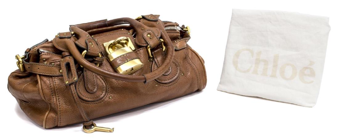 CHLOE 'PADDINGTON' GRAINED LEATHER HAND BAG: Chloe "Paddington" in brown leather with gold tone hardware, exterior flap pockets, top unzips to canvas lined interior with a zipper pocket, retaining signature lock and key, zippers are numbered but