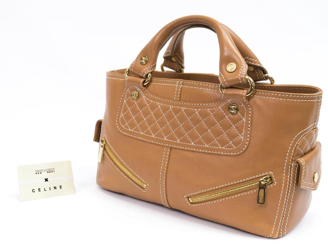 CELINE 'BIKER BOOGIE' BROWN LEATHER HANDBAG: Celine "Biker Boogie" handbag in smooth brown leather, contrast stitching, zippered pockets to front, snap pockets to sides, two top handles, opens to suede lined divided interior, central zippered po