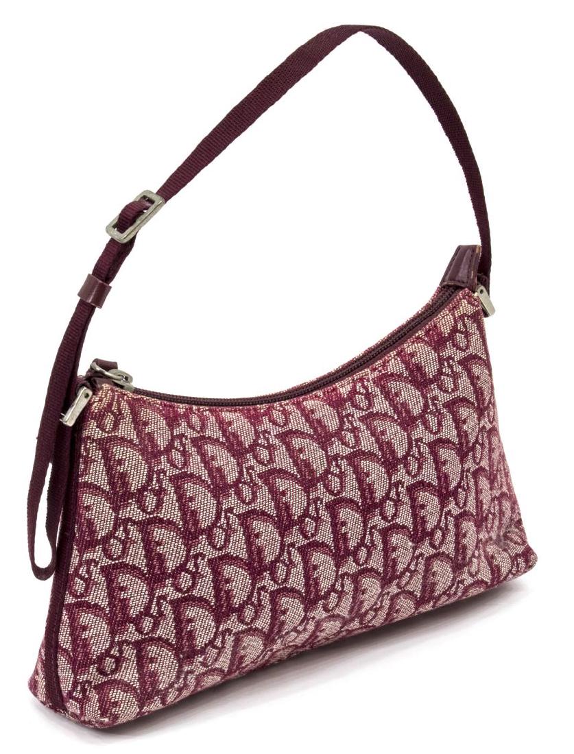 DIOR SMALL BURGUNDY MONOGRAM SHOULDER BAG: Dior small burgundy handbag in monogram canvas, adjustable fabric strap, silver tone hardware, open pocket to interior, wear to metal and leather accents, some discoloration to fabric, especially near