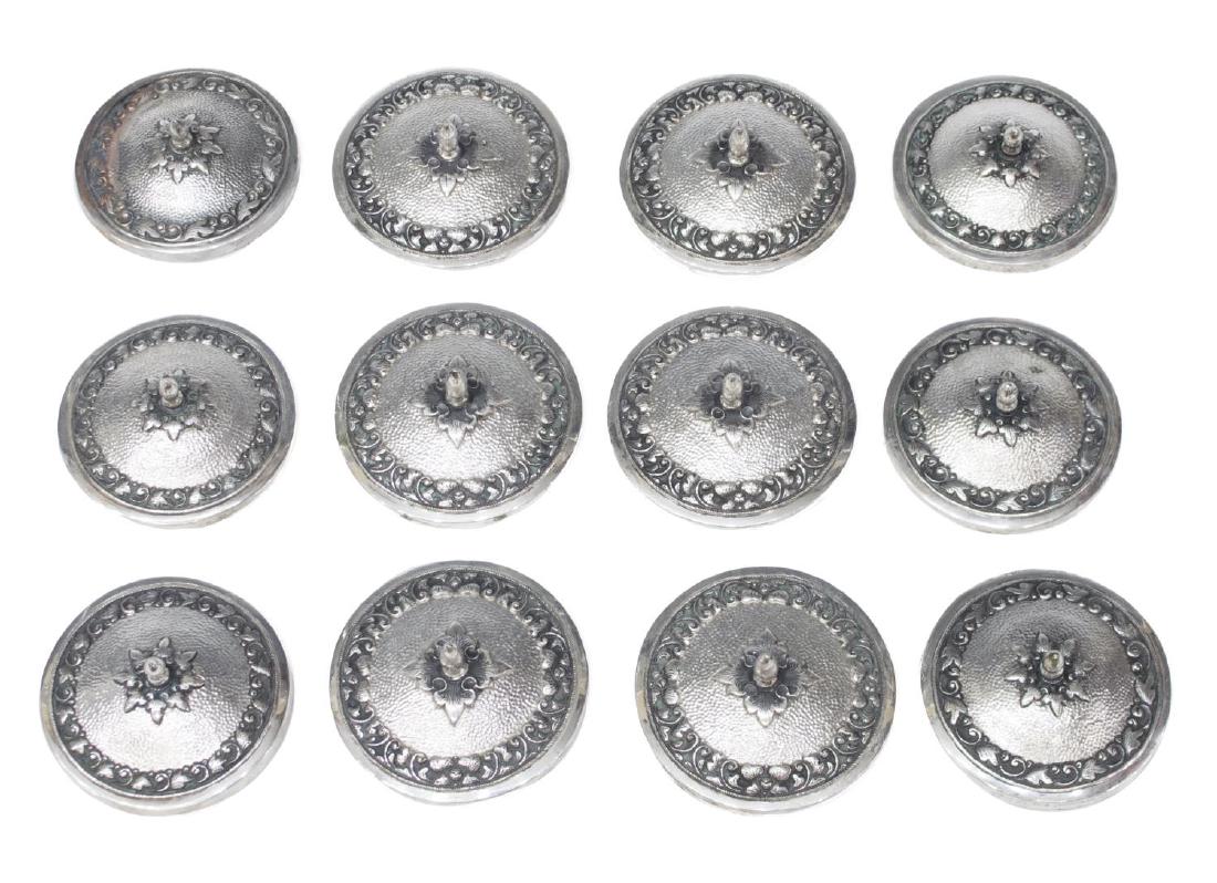 (12) INDONESIAN .800 SILVER REPOUSSE YOGYA LIDS: (lot of 12) Southeast Asian Indonesian .800 silver repousse "Yogya" lids, of circular shape, foliate bands around hammered reserve, with leaf and finial to center; (6) 3.25"diam; (6) 3"diam; 18.79 ozt
