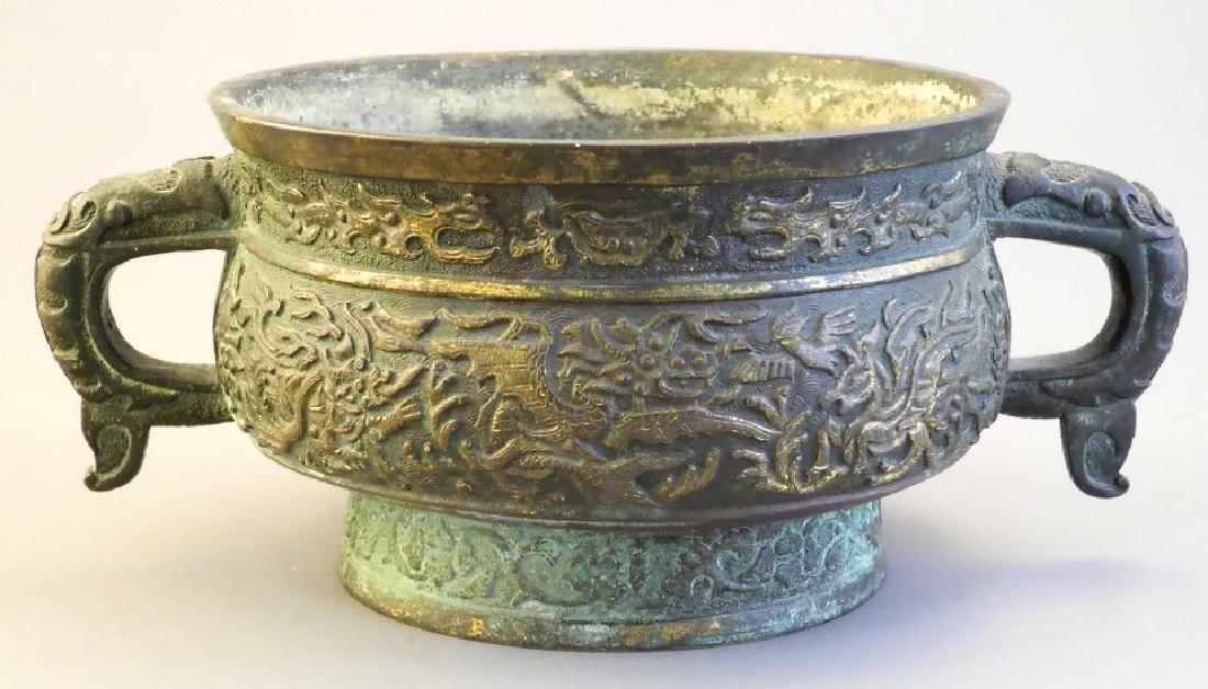 Oriental bronze two handled urn with raised decoration, (1 of 7)