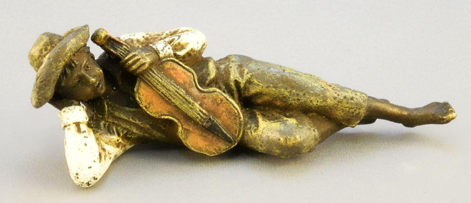 Vienna bronze of a laying boy with fiddle marked: Vienna bronze of a laying boy with fiddle marked Bergman, 3 3/4".